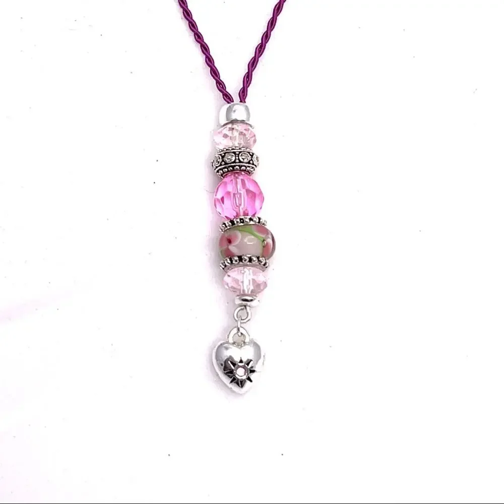 Necklace with heart charm and beads in pink and silver